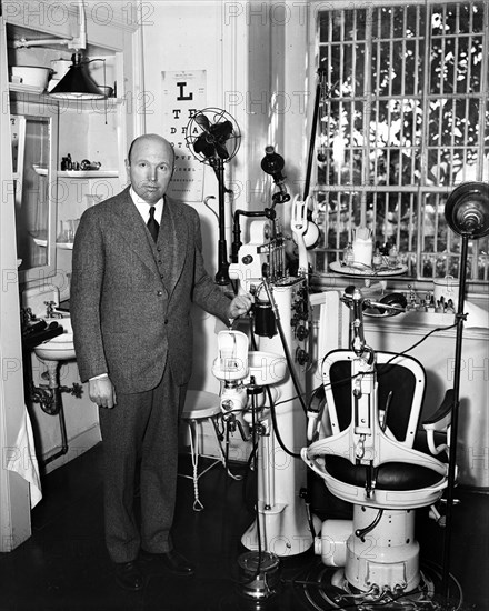 Dentist and dental office interior circa 1934.