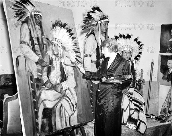 Woman artist Painting portraits of Native Americans circa 1936.