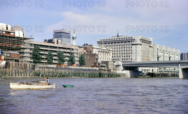 A man in a boat on the River Thames circa 1973.