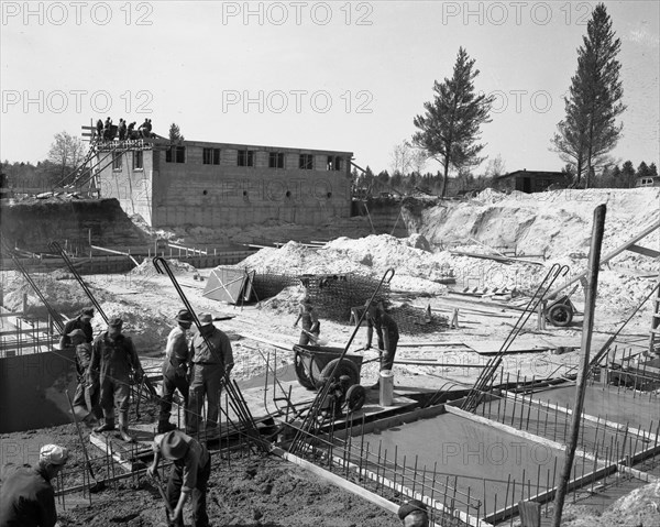 Construction workers pour cement in 1942 at Camp McCoy