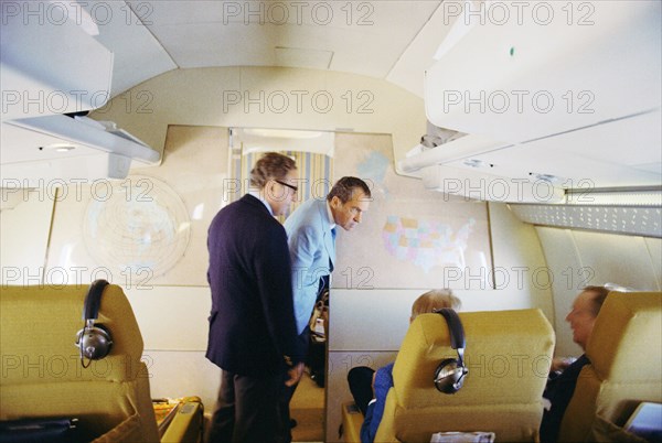 Nixon and foreign policy team on Air Force One.