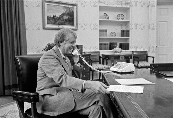 Jimmy Carter at his desk in the Oval Office