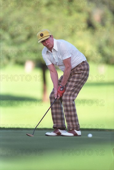 President Reagan playing golf at the Annenberg estate.