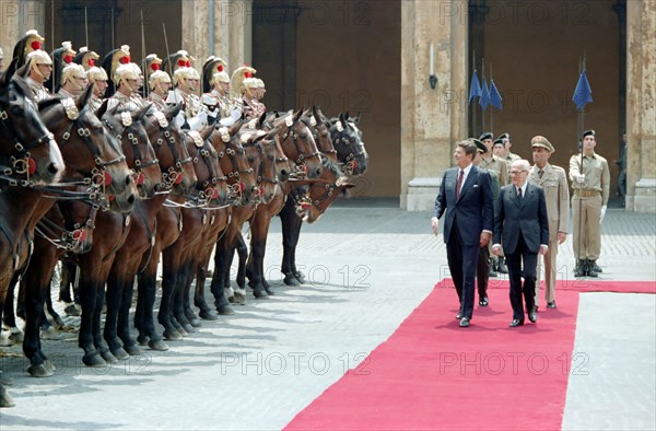 President Reagan and Alessandro Pertini reviewing troops.