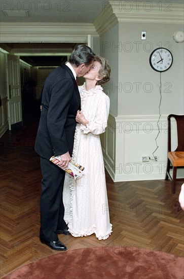 President Reagan kissing Nancy Reagan.