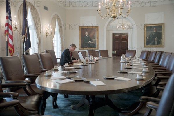 President Reagan working in the White House Cabinet Room.