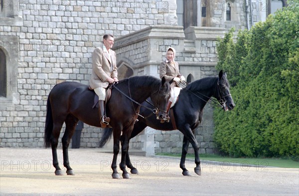 President Reagan and Queen Elizabeth II horseback riding.