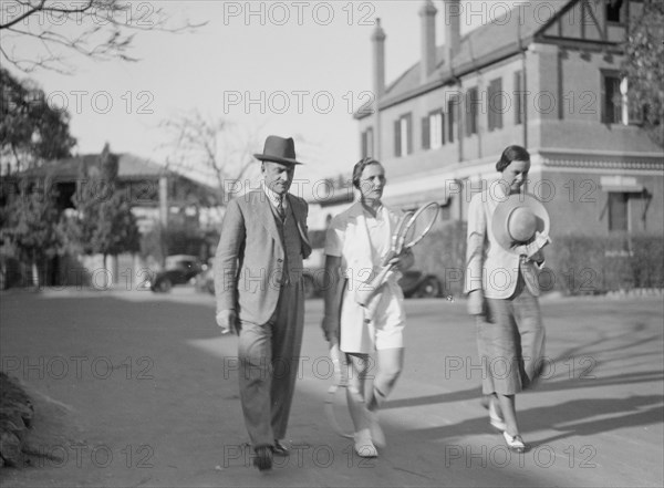 Older woman with tennis raquets at Gezira Gardens & sports club ca. between 1934 and 1939