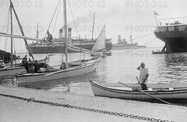 Suez Canal in Egypt, British warships and other boats at the entrance of the canal ca. between 1934 and 1939