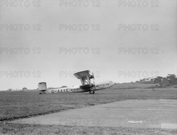 Handley Page H.P. 42 or H.P. 45 Airplane taking off at an airport in Uganda ca. 1936