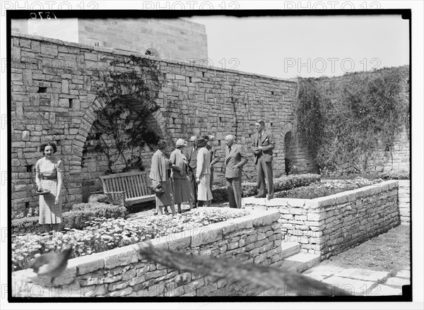 His Excellency Sir Harold MacMichael and house party in the sunken garden ca. between 1934 and 1939