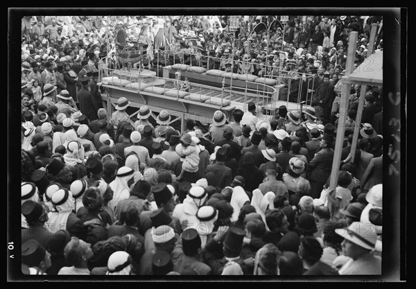 Crowd gathers for a washing of the feet ceremony outside the Church of the Holy Sepulchre ca. 1937