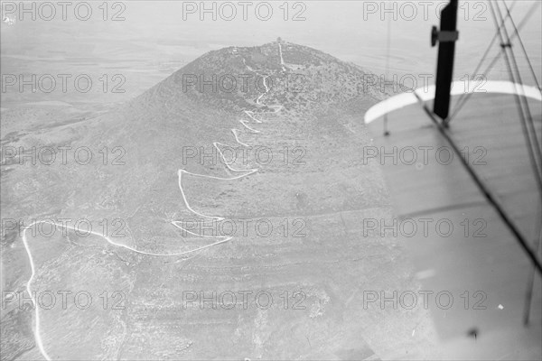 Aerial view of zig-zag motor road up a mountain in Israel (probably Mt. Tabor) ca. 1937