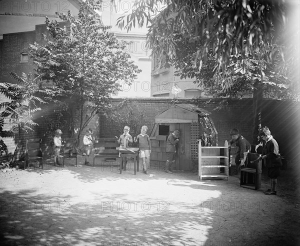 Children playing outside at Mrs. Tomlin's School ca.  between 1910 and 1925