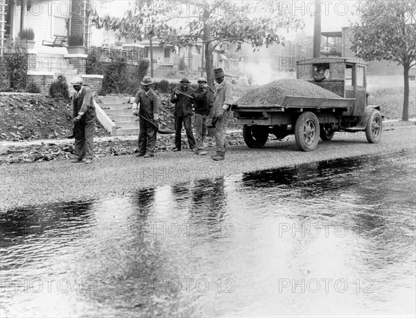 African American men paving a road in Washington, D.C. ca.  1910