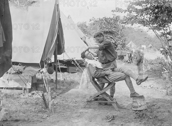 Soldier receiving a shave at a U.S. Army or National Guard camp ca. between 1909 and 1940