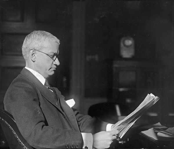 American banker R.C. Leffingwell reading papers ca.  between 1918 and 1920