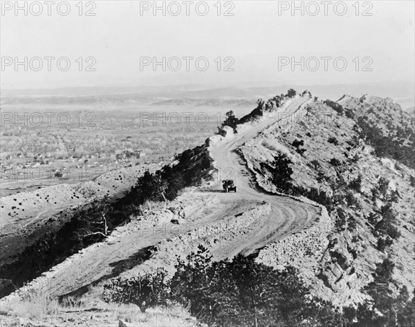 Car on road along ridge in Estes National Park, Colorado, i.e. Rocky Mountain National Park ca. 1909 (before being officially established in 1915)