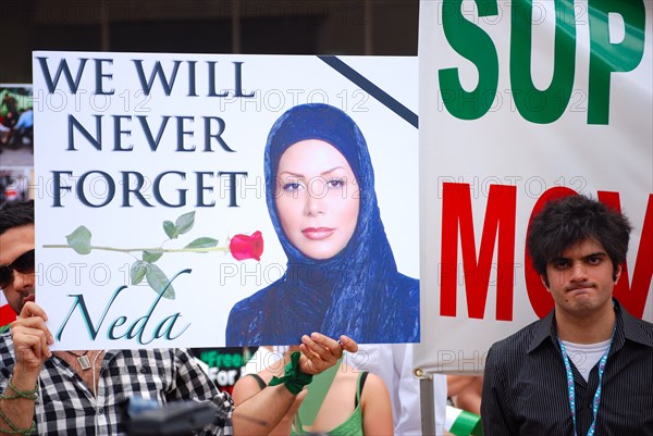 Iranians in Texas taking part in a Freedom for Iran / Green Revolution rally at Dallas City Hall plaza in downtown Dallas, TX ca. June 2009