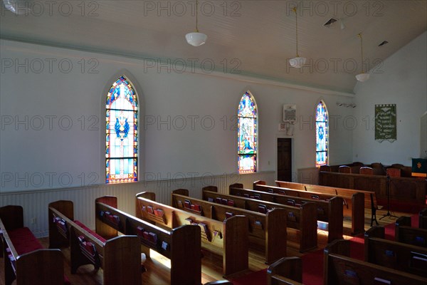 Interior of the United Methodist Church in Utopia, TX; empty church pews