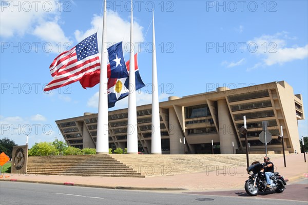 Dallas, Texas, USA. 10th July, 2016. Flags at half staff at Dallas City Hall