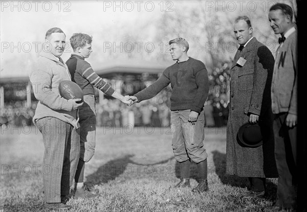 Football players shaking hands at Georgetown University football game