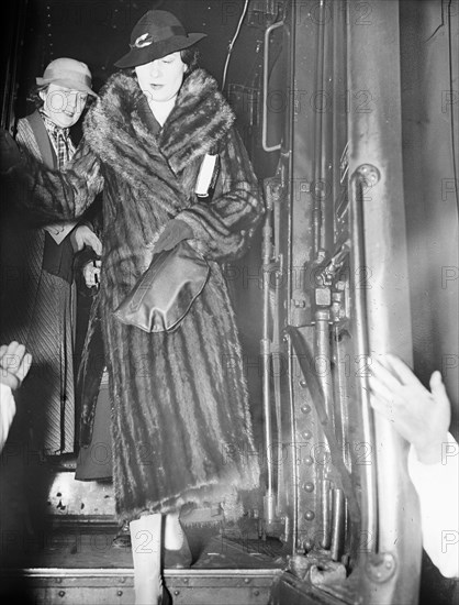 Luxurious woman wearing a fur coat