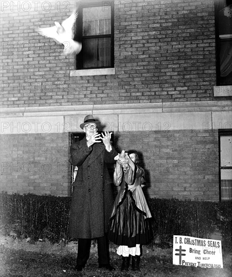 Man and child releasing birds