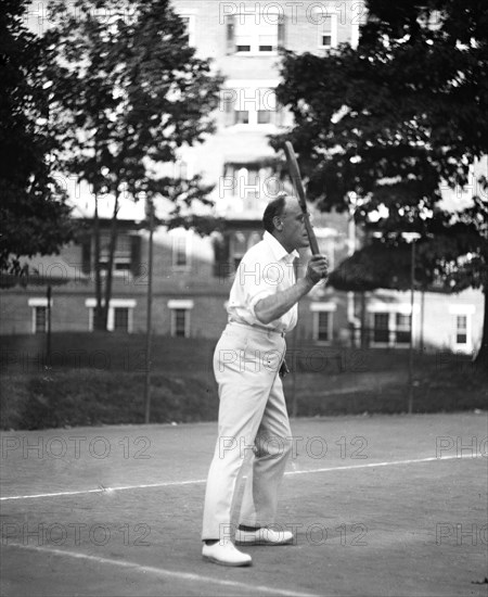 Man playing tennis ca. 1919