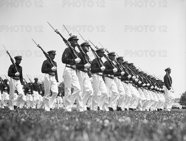 Navy midshipmen drilling