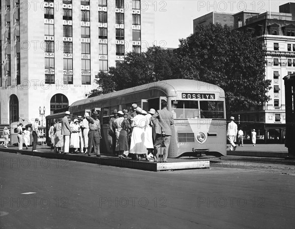 Passengers waiting to board a streamlined street car