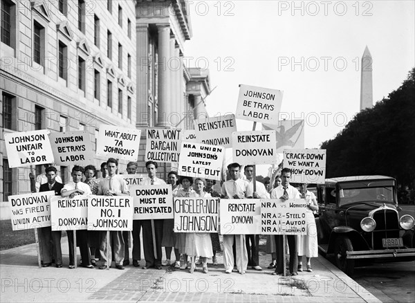 Protesters with signs: 'Johnson unfair to labor