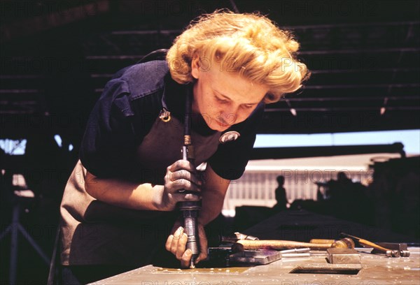 Working in the Assembly and Repair Dept. of the Naval Air Base