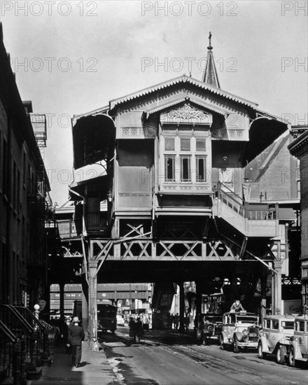 1930s New York City - El' station, Ninth Avenue Line, Christopher and Greenwich Streets, Manhattan. Line of cabs, below elevated railroad station, elevated structure (West Side Highway?) beyond. ca. 1936