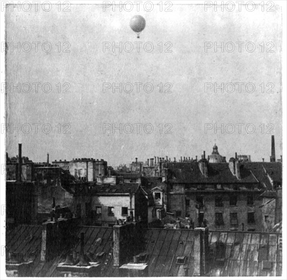 Captive balloon of Henri Giffard over Paris, 1878; high above rooftops