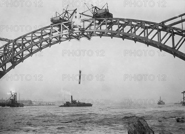 Workers completing Hell Gate Bridge, originally the New York Connecting Railroad Bridge, or the East River Arch Bridge ca. 1912-1916