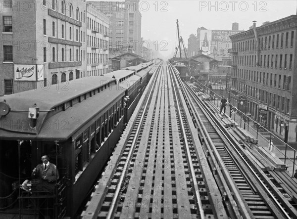 Express tracks of the Ninth Avenue El (elevated railroad) with a train, at the 14th Street Station in New York City ca. 1914-1915