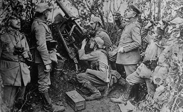 German soldiers with a anti-aircraft machine gun, looking for airplanes during World War I ca. 1914-1915