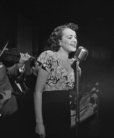 Portrait of a vocalist with Justin Stone's ensemble, between 1938 and 1948