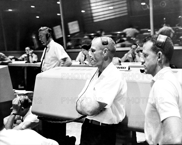 (21 July 1961) View of the Mission Control Center at Cape Canaveral during the Mercury-Redstone 4 (MR-4) mission. Astronauts John Glenn (left) and L. Gordon Cooper (right) act as spacecraft communicators (CAPCOM).