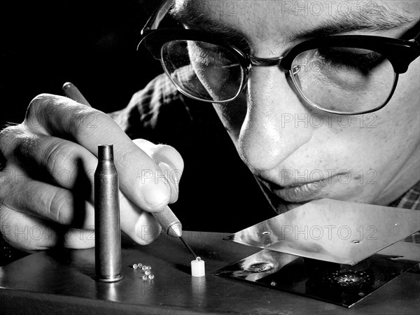 Researcher Examines Pellets for Micrometeorite Impact Studies ca. 1959