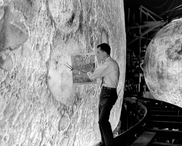 Artists used paintbrushes and airbrushes to recreate the lunar surface on each of the four models comprising the LOLA simulator. ca. 1965