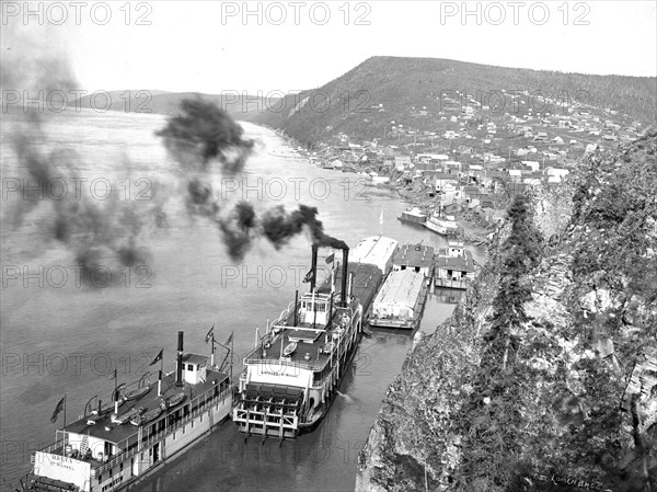 Riverboats distant view of town 1900-1923 possibly Ruby, Alaska yukon river