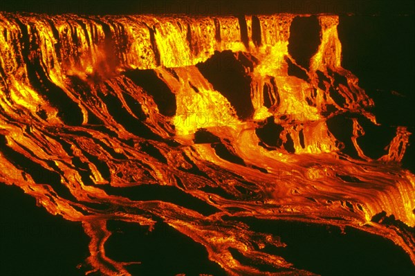 1969 - Lava falls pour into 'Alae Crater at 11 p.m., HST, on August 5, 1969, supplied by a high lava fountain at Mauna Ulu, 600 m (2,000 feet) away. The falls, more than 100 m (330 ft) high and 300 m (1,000 ft) wide, had nearly filled the crater by the ti