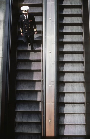 Navy captain entering the city's Metro subway system