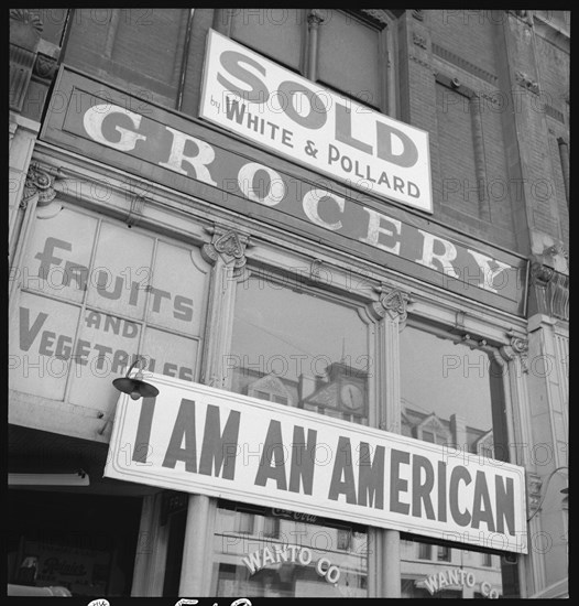 I Am An American sign outside grocery store