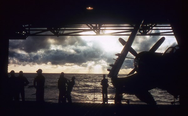 Silhouette view of a 7th Fleet Hangar Deck during the Korean War. August 1952.