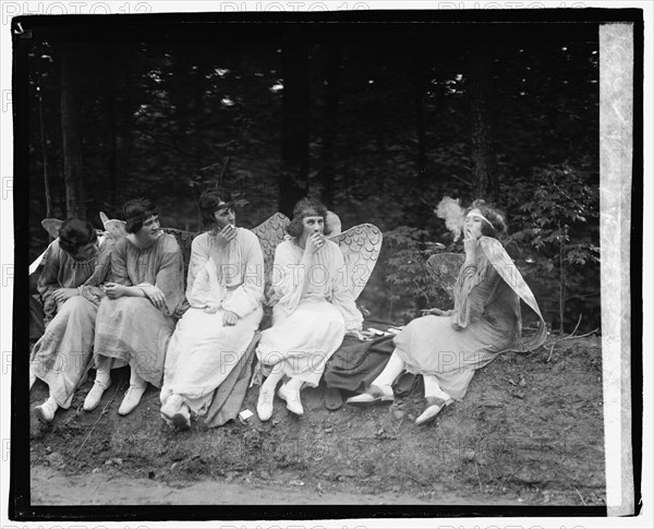 TitleCross Triumphant, 5/10/22SummaryPhotograph shows performers taking a cigarette break during The Cross Triumphant pageant at the Episcopal Cathedral. (Source: researcher A. Walker, 2021 and The Evening Star, May 11, 1922)Created / Published[19]22 May 10.HeadingsGlass negatives.GenreGlass negativesNotes-  Title from unverified data provided by the National Photo Company on the negatives or negative sleeves.