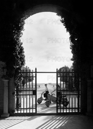 People On A Motorcycle. Italy 1960-70