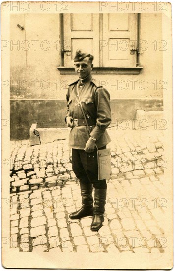 Soviet Army lieutenant, standing on the street.